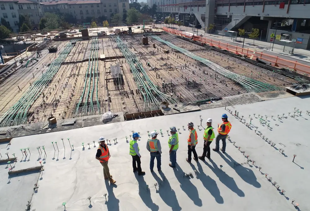 Construction professionals coordinating work at an active job site