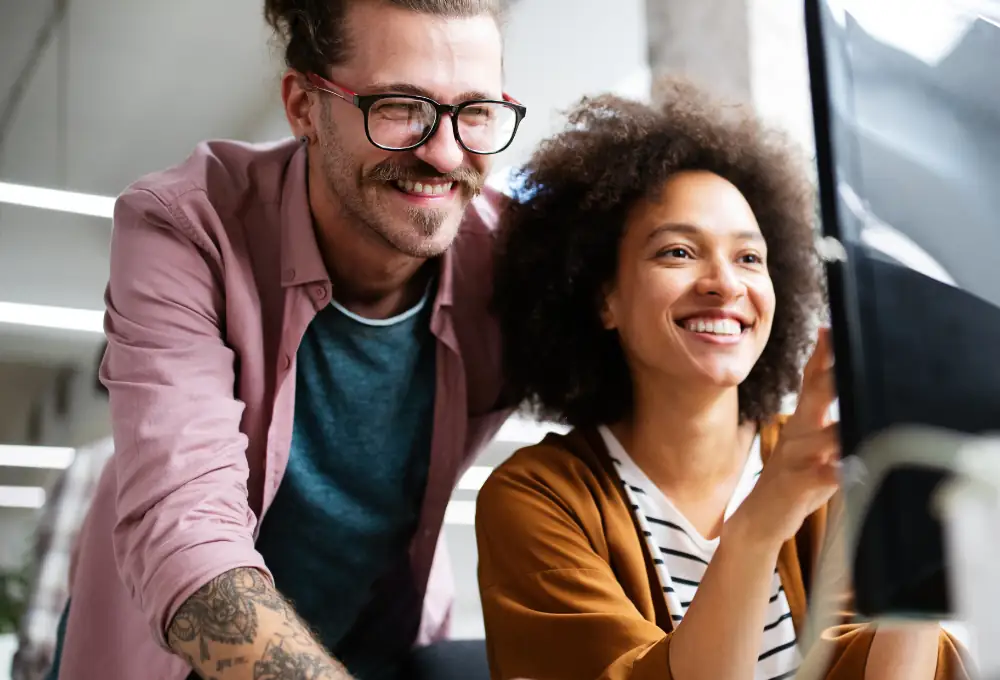 Small professional-services business collaborating at a computer